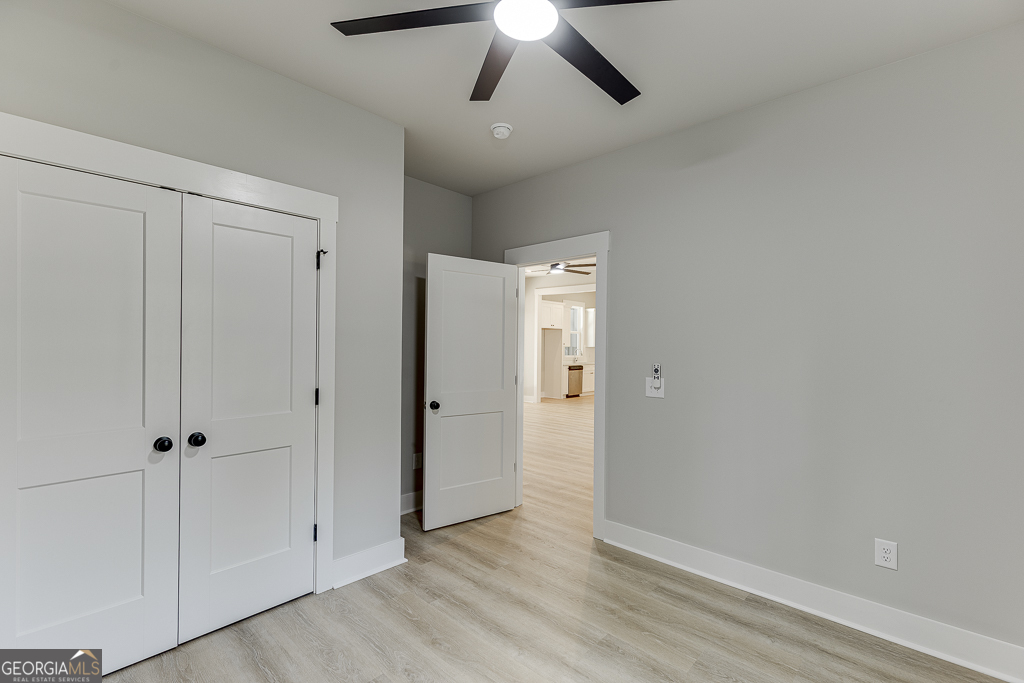 115 Rains Road Jefferson, GA 30549 - Photo 20 of 44 a view of empty room with wooden floor