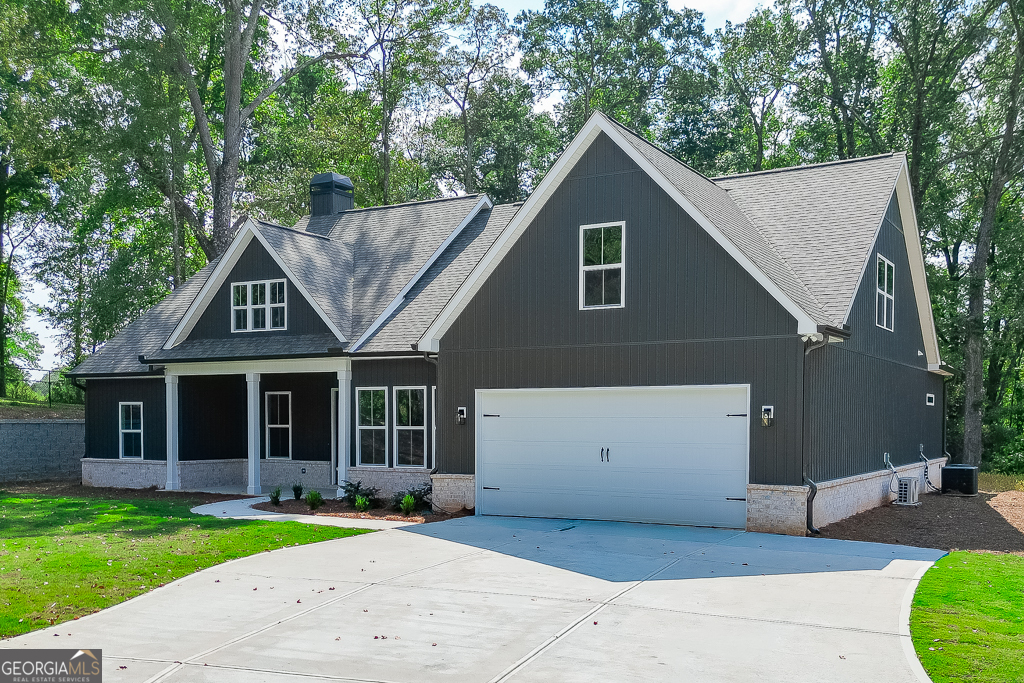115 Rains Road Jefferson, GA 30549 - Photo 2 of 44 a front view of a house with a yard
