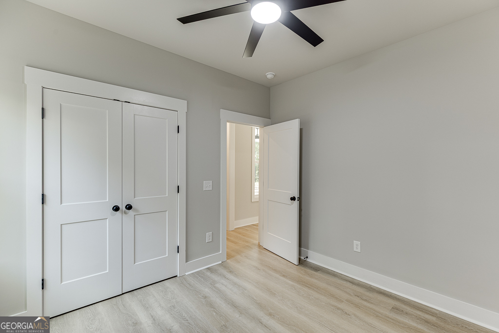 115 Rains Road Jefferson, GA 30549 - Photo 22 of 44 wooden floor in an empty room