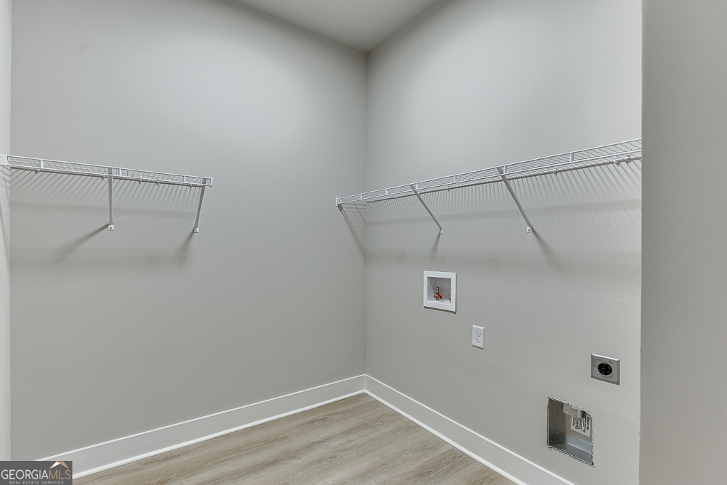 115 Rains Road Jefferson, GA 30549 - Photo 26 of 44 a view of a room with racks on the wall