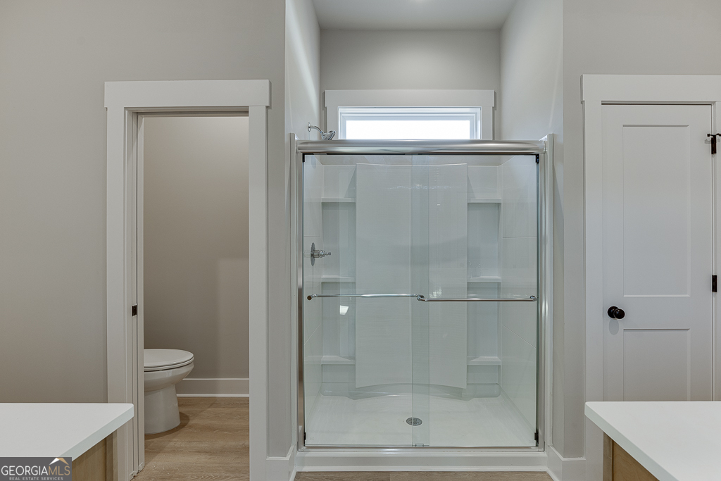 115 Rains Road Jefferson, GA 30549 - Photo 30 of 44 a bathroom with a glass door shower