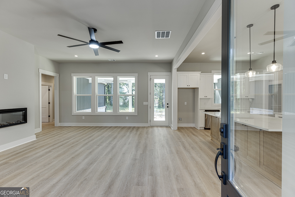 115 Rains Road Jefferson, GA 30549 - Photo 4 of 44 a view of an empty room and glass door