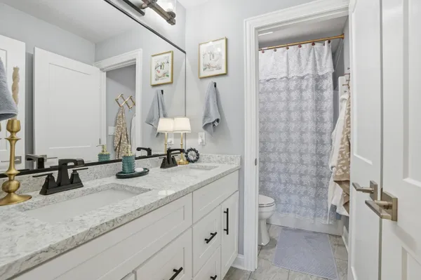 a open kitchen with stainless steel appliances granite countertop a stove a sink and dishwasher