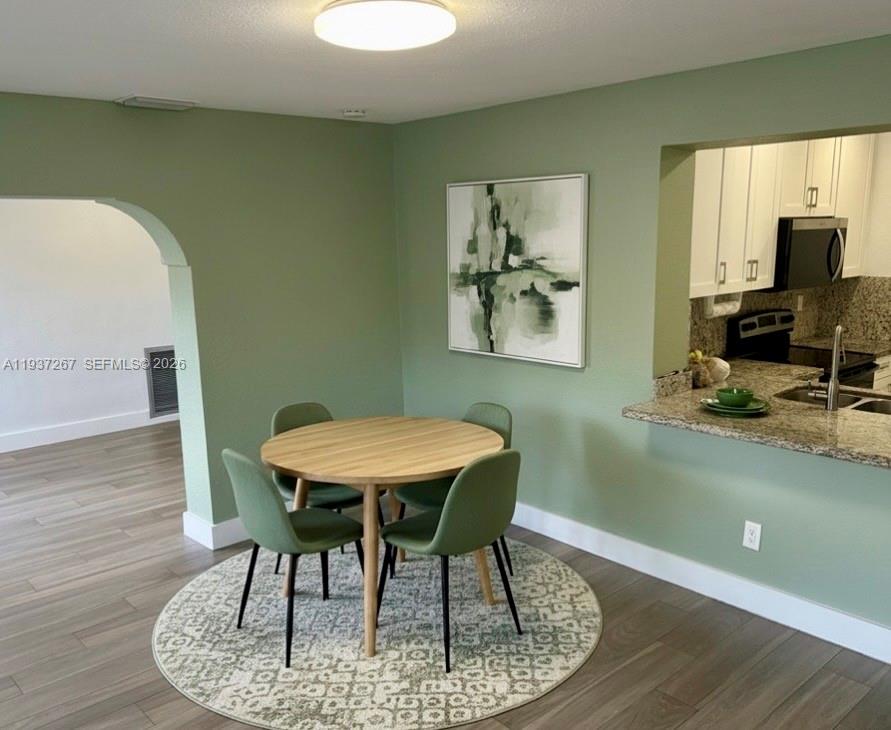 231 Southwest 51st Place Miami, FL 33134 - Photo 13 of 26 a dining room with furniture and window