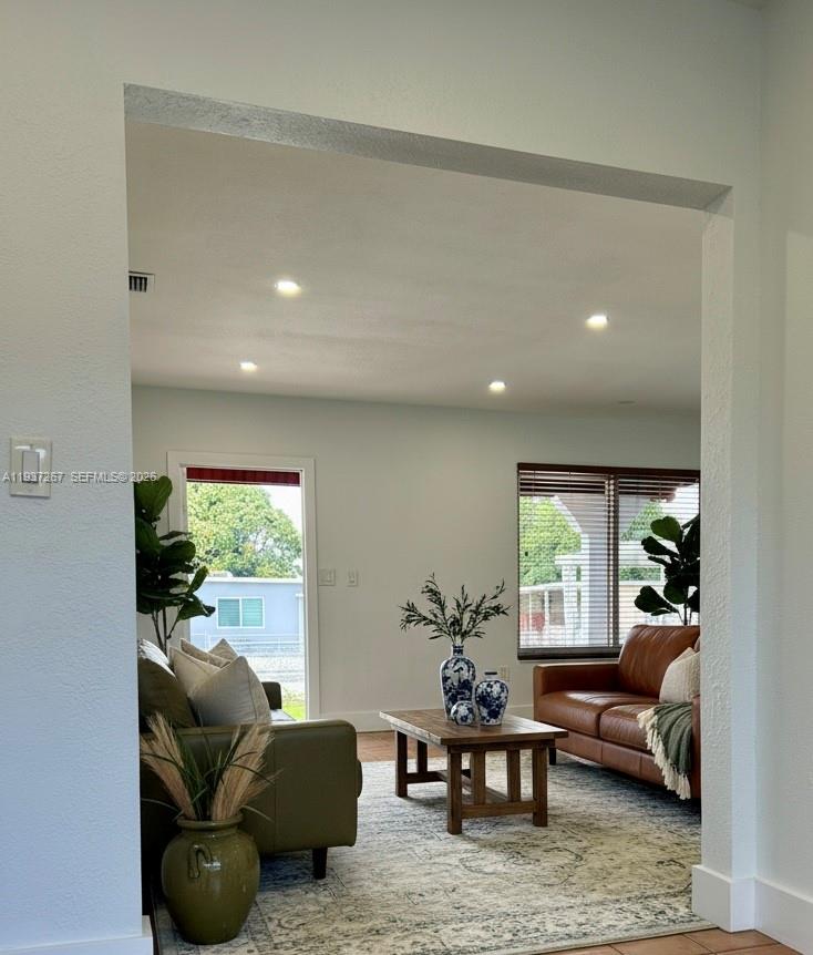 231 Southwest 51st Place Miami, FL 33134 - Photo 3 of 26 a living room with furniture and a large window