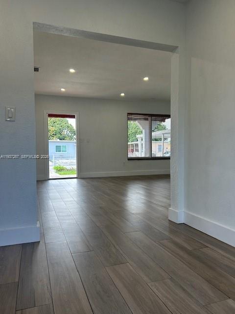 231 Southwest 51st Place Miami, FL 33134 - Photo 4 of 26 an empty room with wooden floor and windows