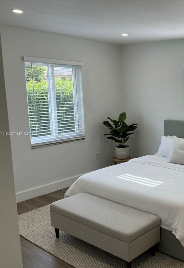 231 Southwest 51st Place Miami, FL 33134 - Photo 10 of 26 a bedroom with a bed and a window