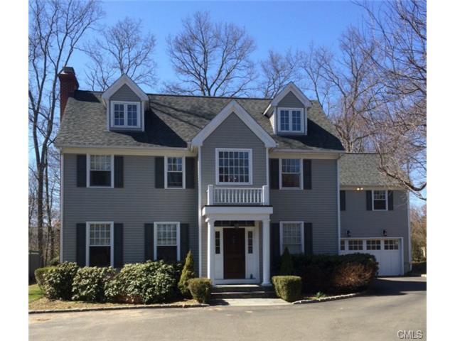 a front view of a house with yard