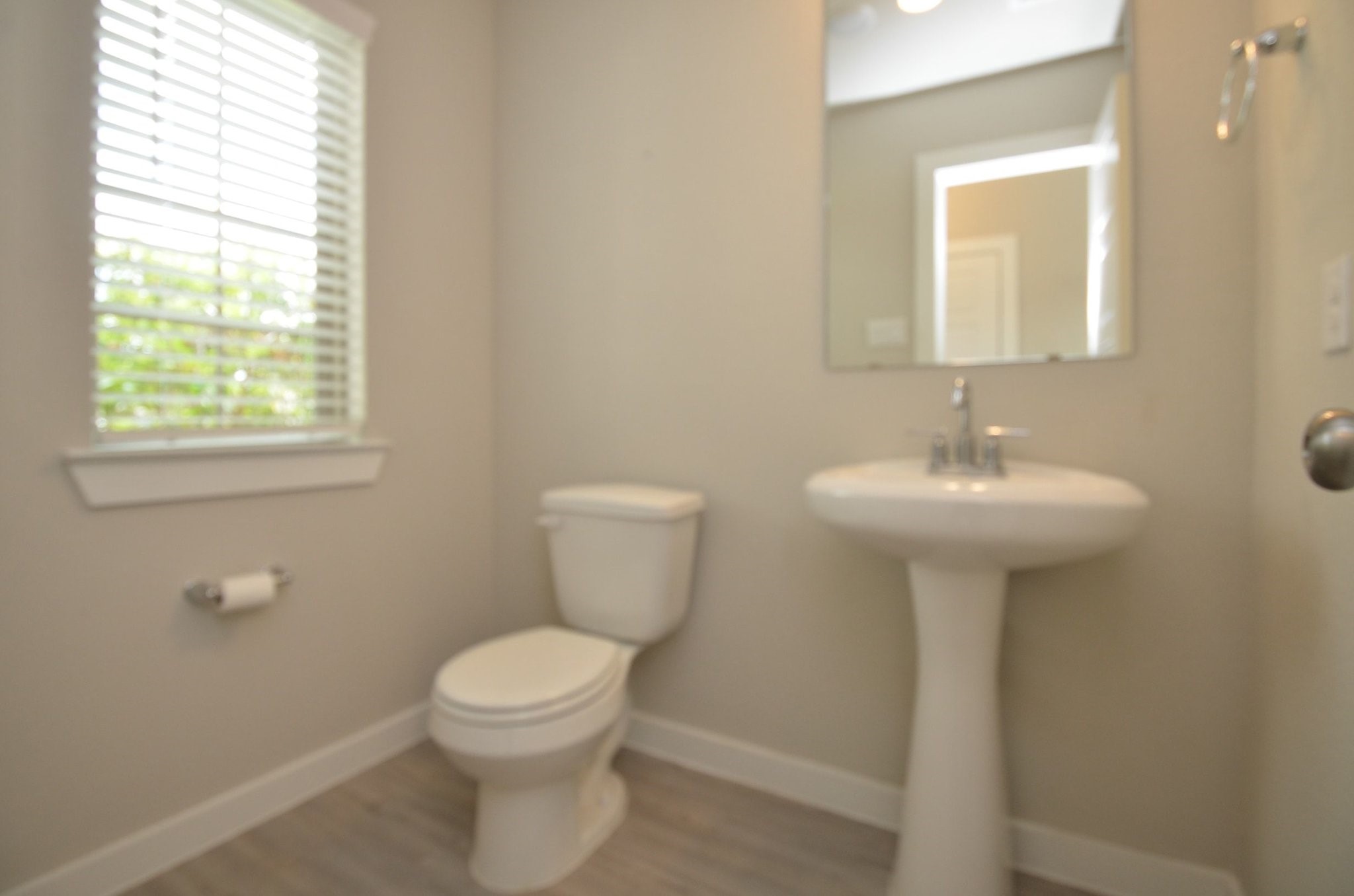 8230 Blue Fish Drive Cypress, TX 77433 - Photo 13 of 18 Half bathroom is located towards the front of the home