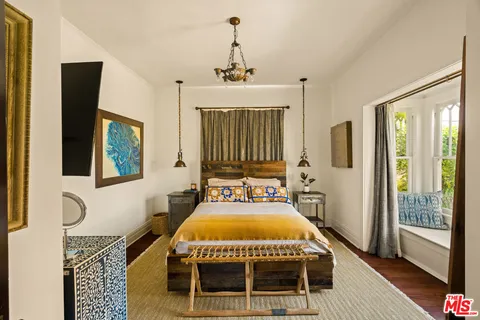 a bathroom with a sink a toilet and a shower