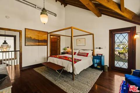 a bathroom with a sink a vanity and a shower curtain