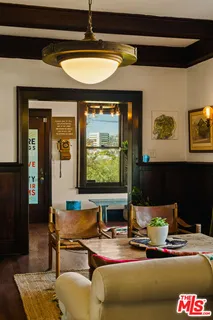 a open kitchen with stainless steel appliances granite countertop a sink a stove and wooden floors