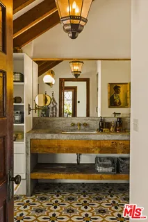 a view of a chairs and table in the balcony