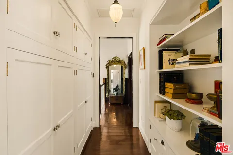 a living room with furniture a rug and a chandelier