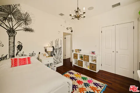 a bathroom with a sink a mirror and vanity