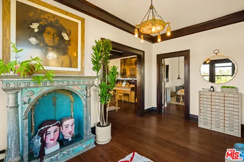a living room with furniture fireplace and flat screen tv