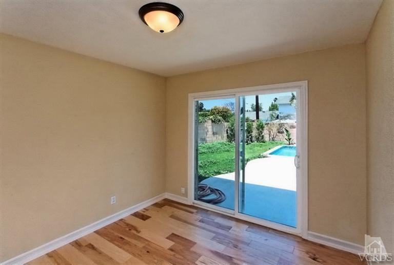 1391 Lowery Street Simi Valley, CA 93065 - Photo 13 of 16 a view of room with wooden floor and fan