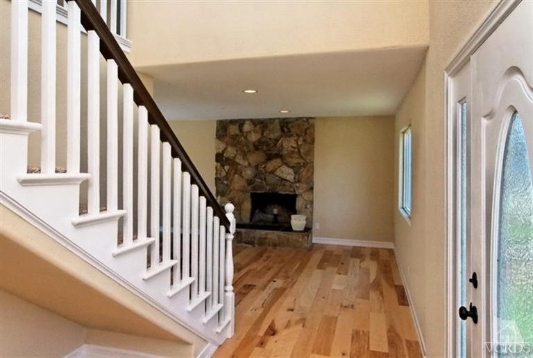 1391 Lowery Street Simi Valley, CA 93065 - Photo 4 of 16 a view of a livingroom with wooden floor and staircase