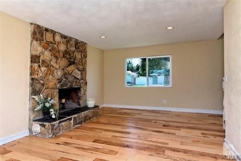 1391 Lowery Street Simi Valley, CA 93065 - Photo 5 of 16 a view of wooden floor fire place and windows in a room