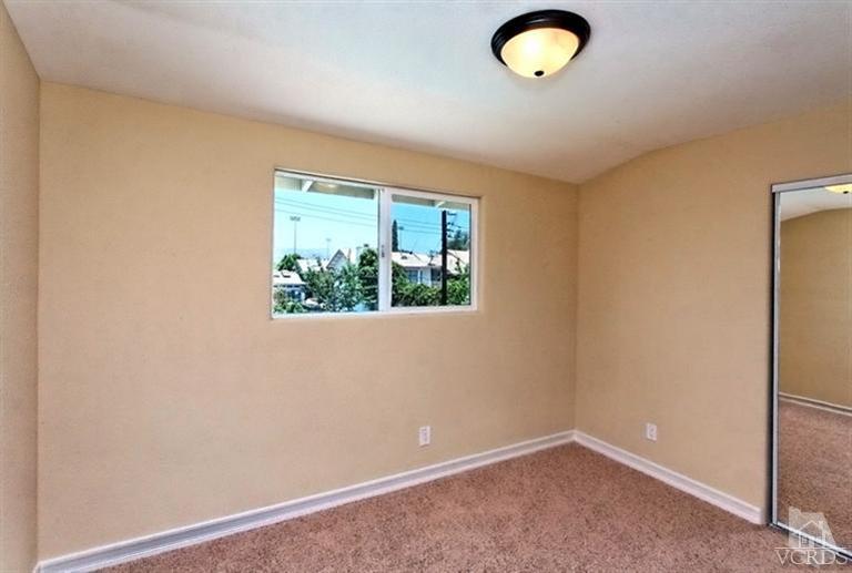 1391 Lowery Street Simi Valley, CA 93065 - Photo 9 of 16 an empty room with a window