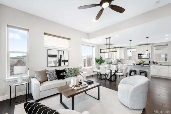 a living room with furniture and a large window