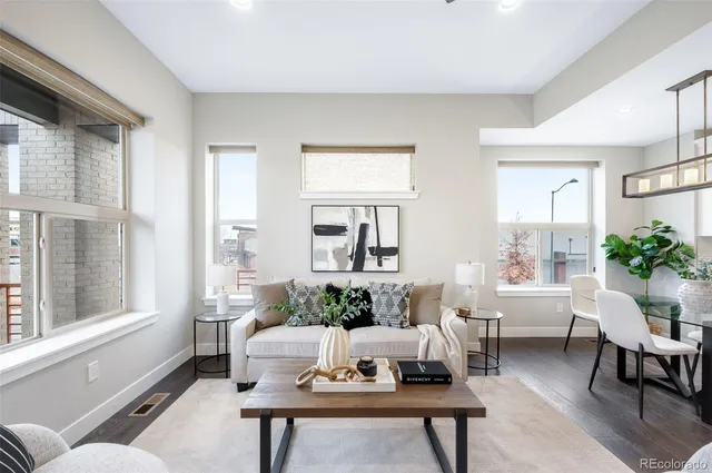 a living room with furniture and windows
