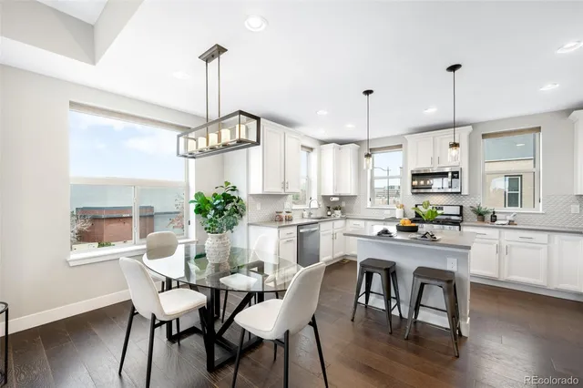 a view of a dining room with furniture window and wooden floor
