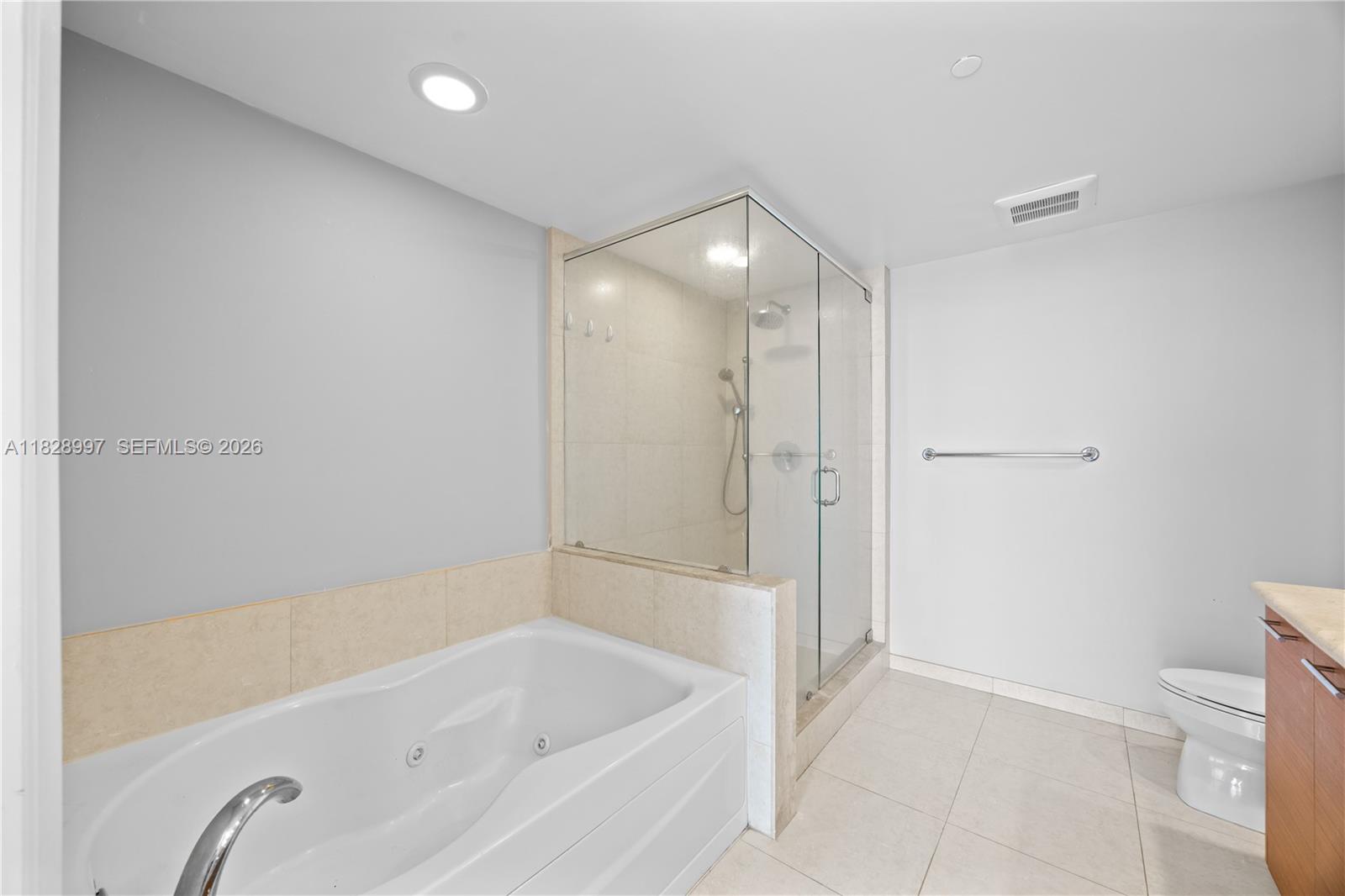 50 Biscayne Boulevard, Unit 4706 Miami, FL 33132 - Photo 18 of 49 a bathroom with a bathtub and a shower
