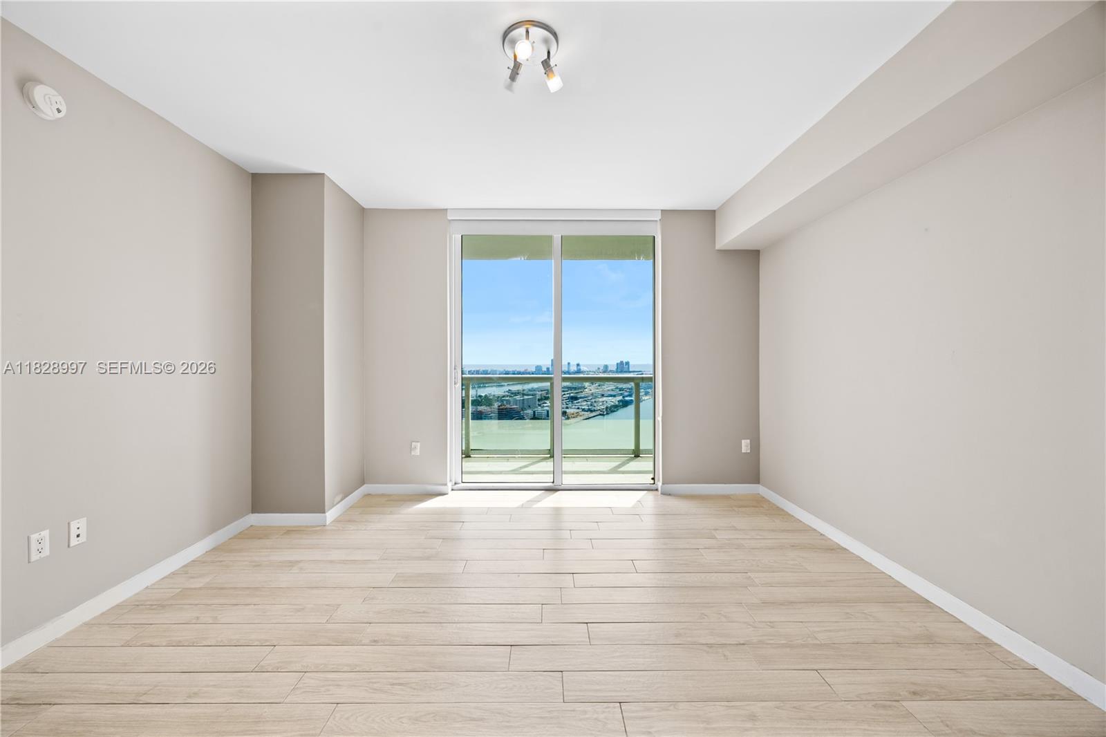 50 Biscayne Boulevard, Unit 4706 Miami, FL 33132 - Photo 26 of 49 a view of an empty room with a window