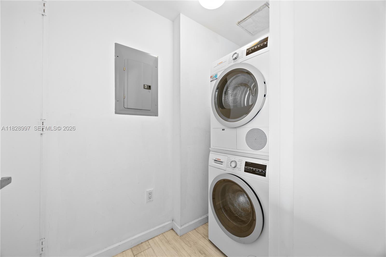 50 Biscayne Boulevard, Unit 4706 Miami, FL 33132 - Photo 30 of 49 a utility room with dryer and washer
