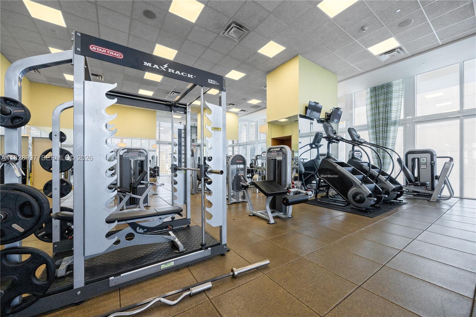 50 Biscayne Boulevard, Unit 4706 Miami, FL 33132 - Photo 47 of 49 a view of a room with gym equipment