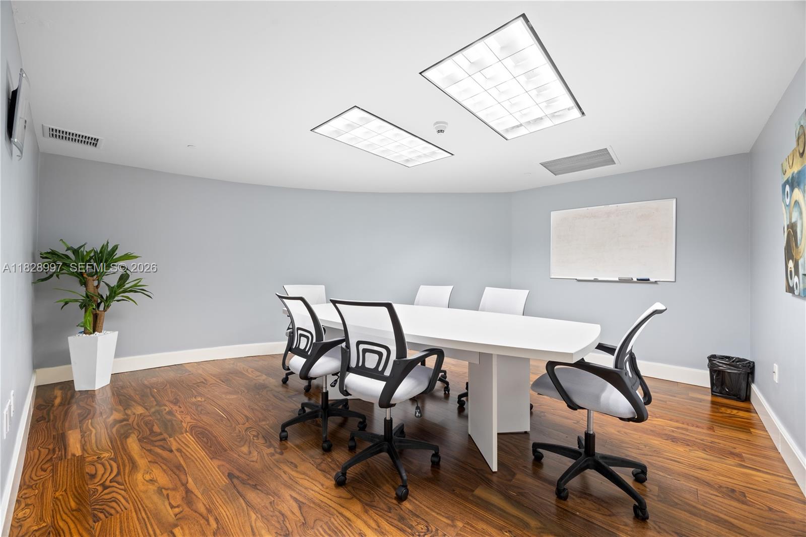 50 Biscayne Boulevard, Unit 4706 Miami, FL 33132 - Photo 48 of 49 a view of a dining room with furniture and wooden floor