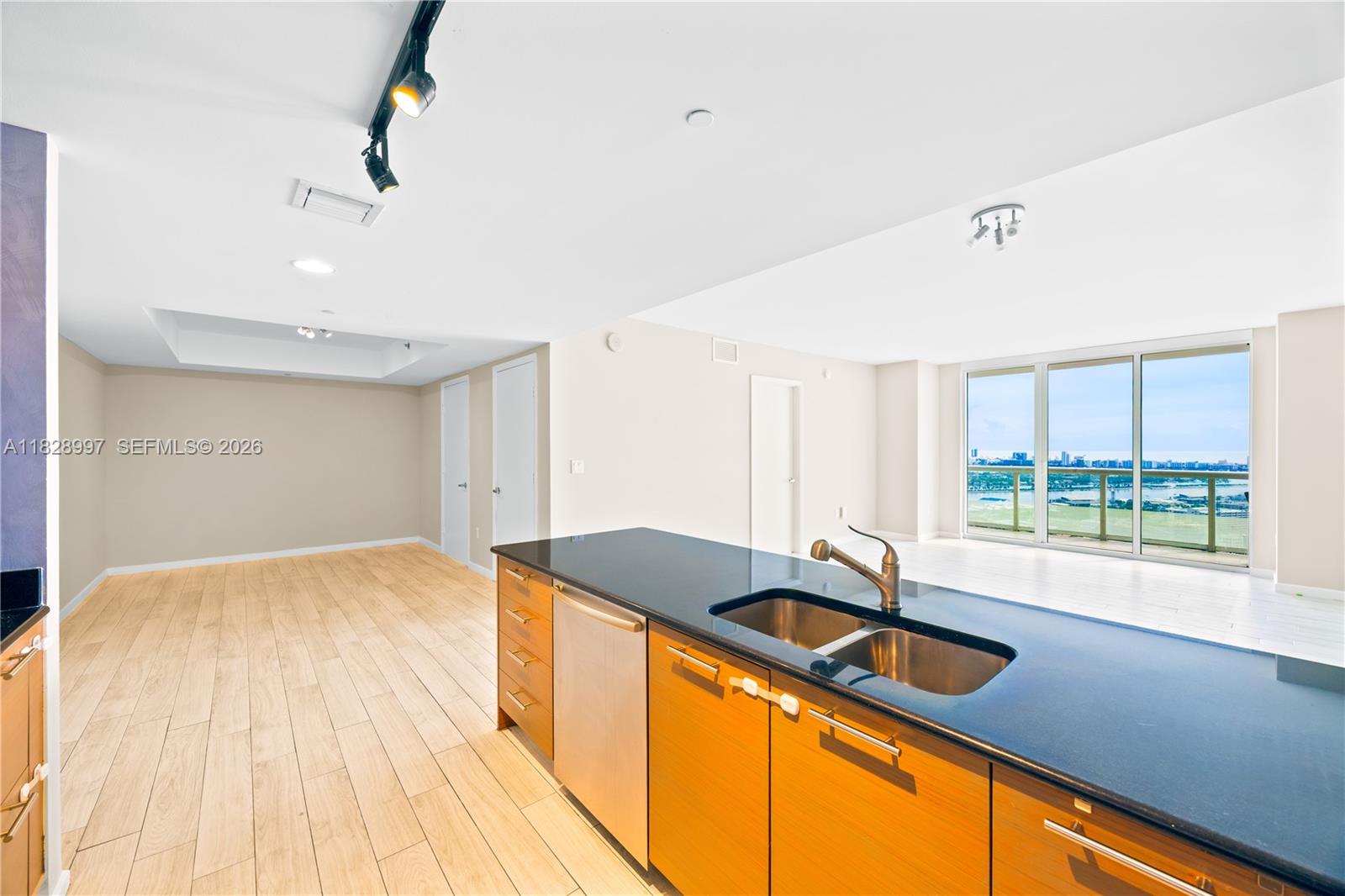 50 Biscayne Boulevard, Unit 4706 Miami, FL 33132 - Photo 5 of 49 a kitchen with a sink and large window