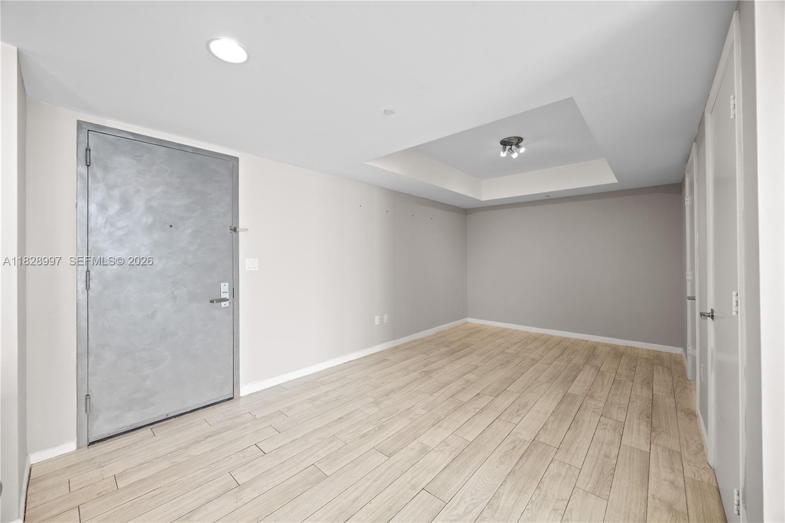 50 Biscayne Boulevard, Unit 4706 Miami, FL 33132 - Photo 7 of 49 a view of an empty room with wooden floor