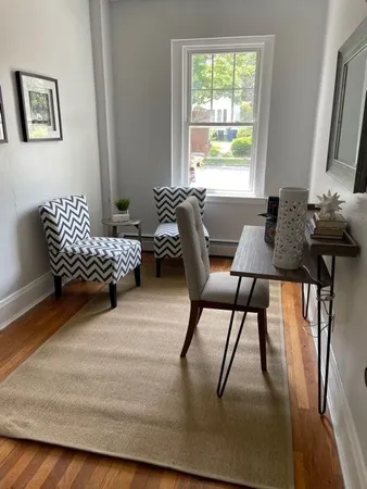 a bedroom with furniture and a window