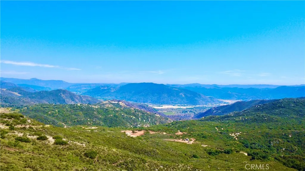 0 Sunset Peak Valley Center, CA 92082 - Photo 11 of 17 a view of a mountain range in a cloudy sky