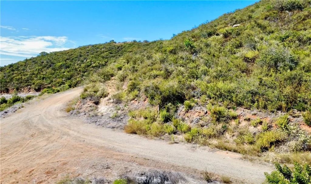 0 Sunset Peak Valley Center, CA 92082 - Photo 16 of 17 a view of a road with a yard