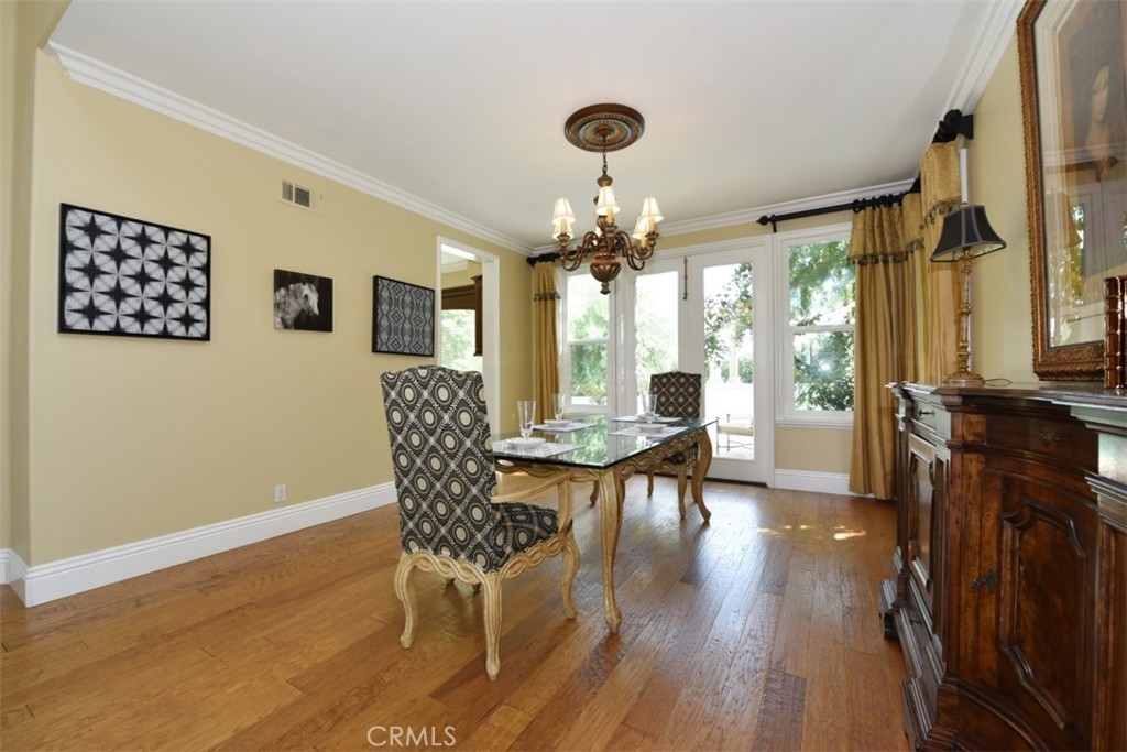 12 Brigadier Irvine, CA 92603 - Photo 14 of 50 a view of a dining room with furniture window and wooden floor