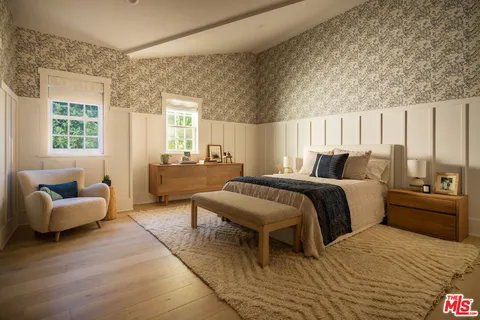 a bedroom with a bed and a couch