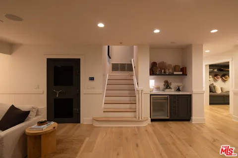 a kitchen with stainless steel appliances kitchen island granite countertop a stove and a refrigerator