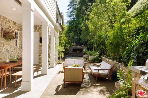 a outdoor space with patio the couches and a dining table with the view of garden