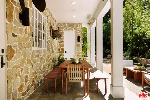 a view of a balcony with chairs