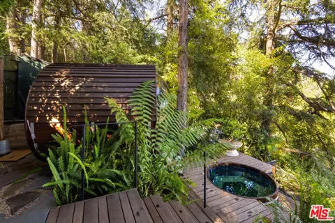 a view of outdoor space with deck and tree