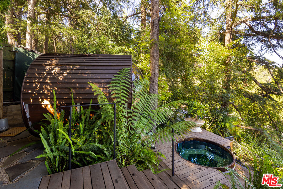 664 Elkins Road Los Angeles, CA 90049 - Photo 36 of 40 a view of outdoor space with deck and tree