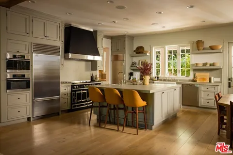a kitchen with counter top space cabinets and stainless steel appliances