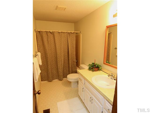 8728 Danbury Circle Raleigh, NC 27613 - Photo 20 of 25 Hall bath, with tub/shower combination, and ceramic flooring.