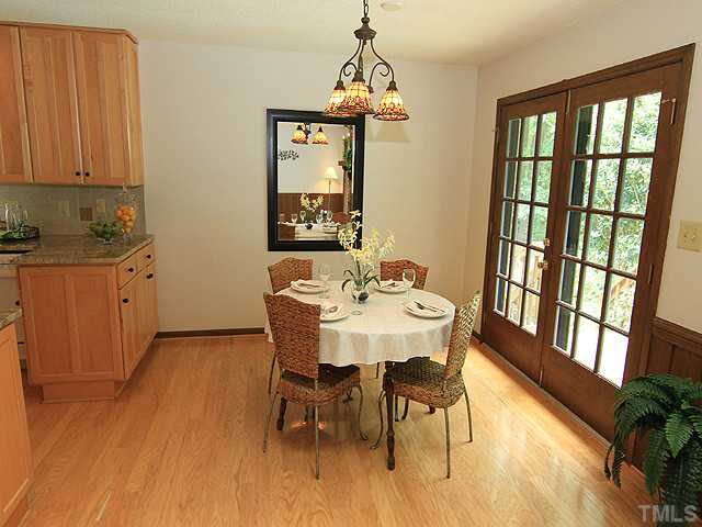 8728 Danbury Circle Raleigh, NC 27613 - Photo 7 of 25 This lovely space allows you to be close to the kitchen and living areas as well. Dine while overlooking the lovely back yard and gardens thru the double frence doors leading to one of the multiple decks.