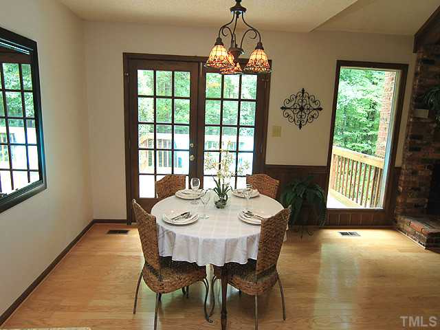8728 Danbury Circle Raleigh, NC 27613 - Photo 8 of 25 Another view of the lovely dining space, no its not a painting, this is your back yard!