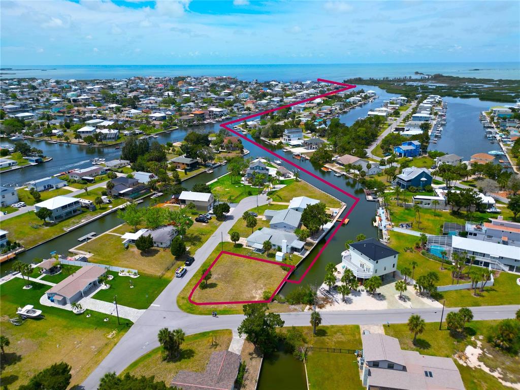 3463 Paragon Terrace Hernando Beach, FL 34607 - Photo 2 of 12 an aerial view of residential houses with outdoor space