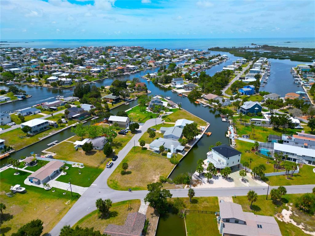 3463 Paragon Terrace Hernando Beach, FL 34607 - Photo 3 of 12 an aerial view of residential houses with outdoor space